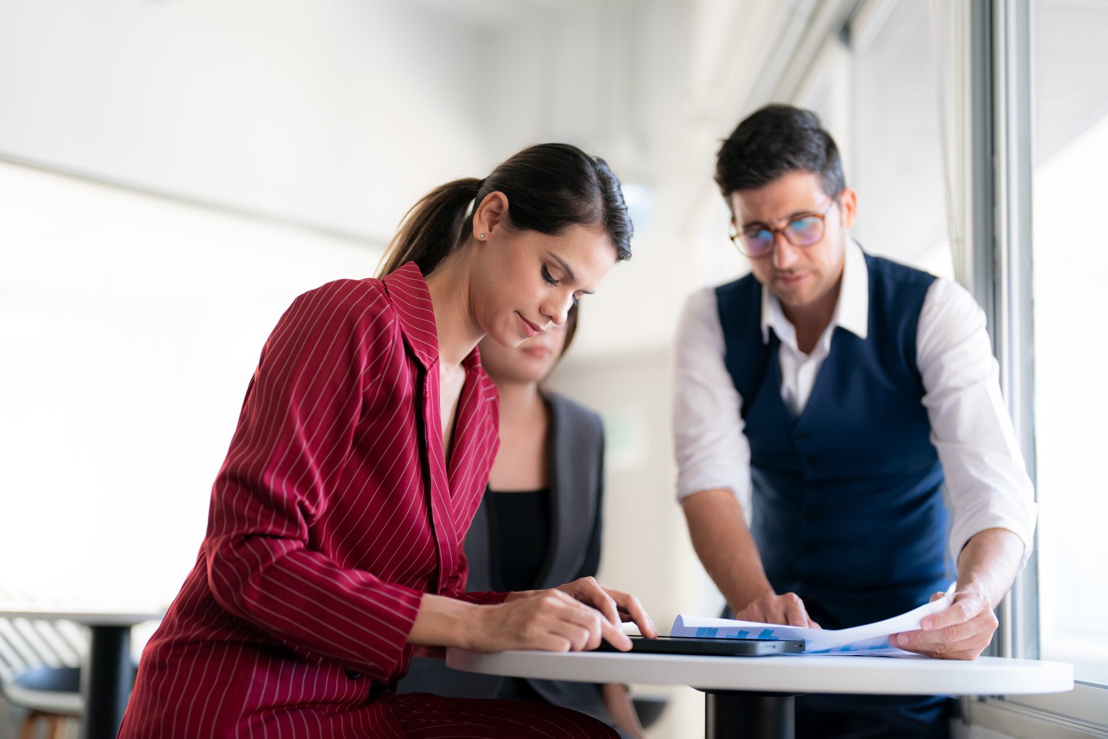 Together we get work done. Group of businesspeople working together as a team in a office.